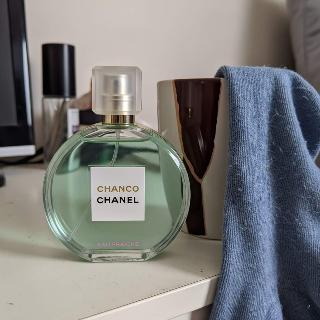 Chanel Chance Eau Fraîche bottle on a messy
