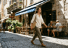 Quiet Luxury Is Fading—What Stylish Women Wear Now A woman walks past a sunlit café in Nice.